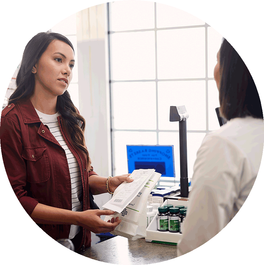 A pharmacist filling a prescription for a patient.