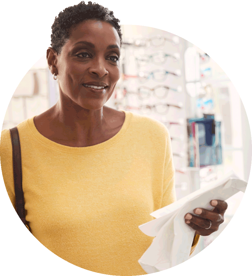 A patient holding their prescription documents.